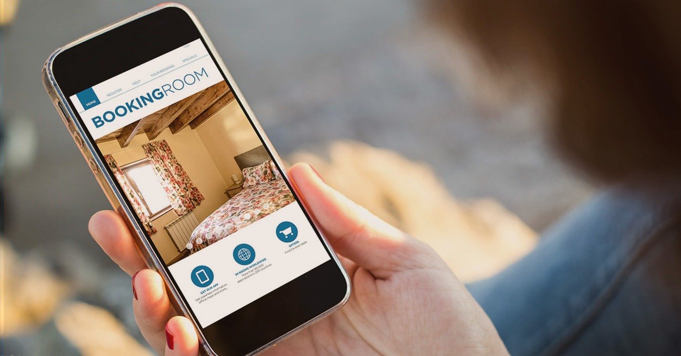 Smartphone showing a mobile hotel booking engine with room selection screen